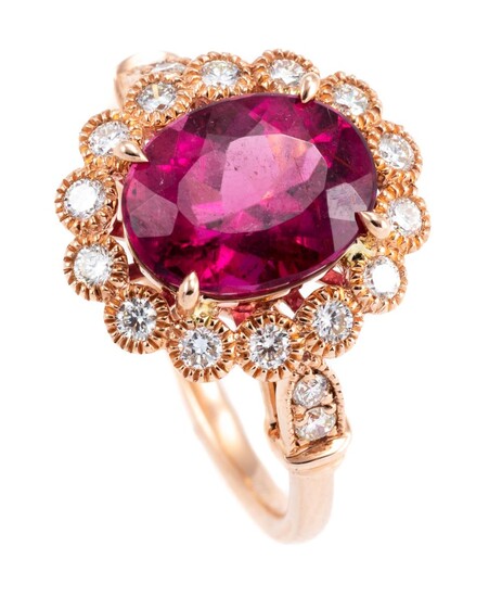 A PINK TOURMALINE AND DIAMOND CLUSTER RING; centring a 2.53ct rubellite to surround and shoulders set with 18 round brilliant cut di...