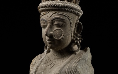A SANDSTONE ARCHITECTURAL BRACKET DEPICTING A GANDHARVA, WESTERN INDIA, 17TH-18TH CENTURY OR EARLIER