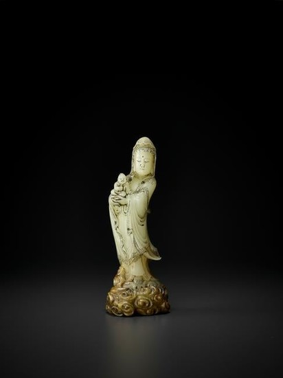 A SOAPSTONE FIGURE OF GUANYIN AND CHILD, QING