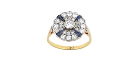 A Synthetic Sapphire and Diamond Cluster Ring the central raised...