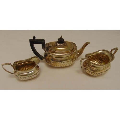 A Victorian hallmarked silver three piece tea set, oval part...