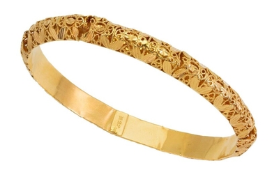 A bangle, of open work filigree design, inner circumference approximately 21cm, gross weight approximately 23g