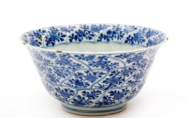 A blue and white moulded swirl flaring bowl