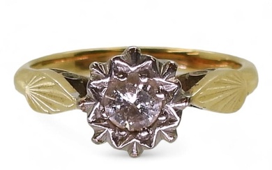 A bright yellow metal ring illusion set diamond ring, set wi...