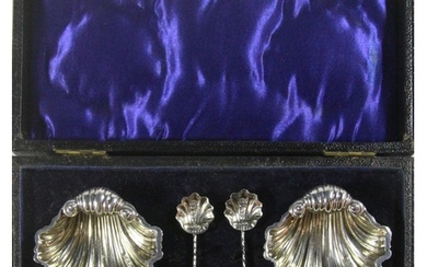 A cased pair of silver salts & spoons of shell design, Chest...