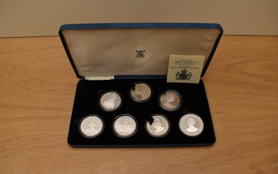 A cased set of 7 1980 Queen Mother 80th Birthday Silver Proof Commemorative Crowns including