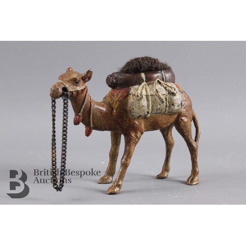 A cold cast bronze camel pin cushion, approx 10 x 8 cms.