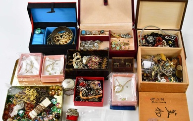 A collection of costume jewellery to include beads, brooches, rings,...