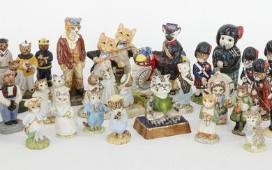 A collection of porcelain character cats, to include examples from Royal Albert, Wade, Royal Doulton, Cat-n-Kin and an unmarked examples, to include two boxed Royal Doulton Cat and the Fiddles with a further pair of unboxed examples, and a Beswick...