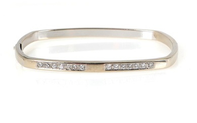 A diamond bangle set with numerous brilliant-cut diamonds, mounted in 14k white...