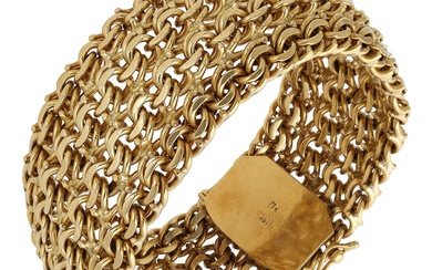 A fancy-link bracelet, the wide strap of woven design, stamped ‘18K’, length...