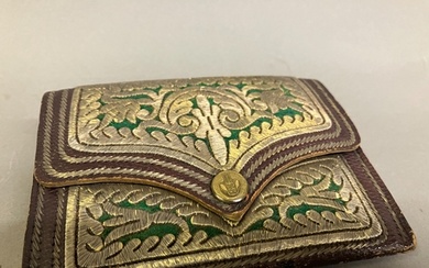A fine quality Ottoman burgundy leather gentleman’s purse wi...