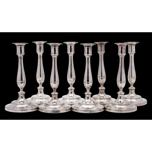 A fine set of eight George III silver candlesticks, maker Ro...