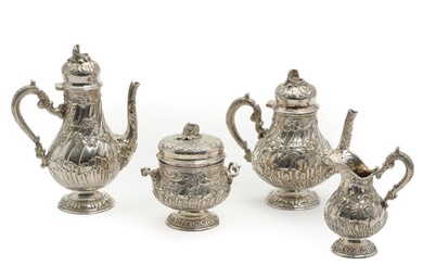A four-piece silver coffee and tea set, comprising a small coffee and...
