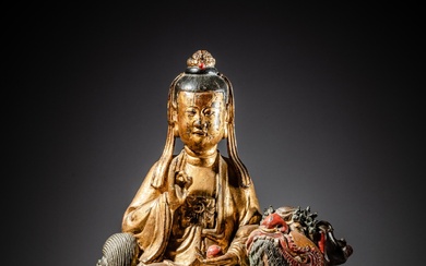A gilt and polychrome lacquer bronze figure of a bodhisattva on a lion, Late Ming - early Qing dynasty, 17th century | 明末至清初十七世紀 漆金銅獅吼觀音像