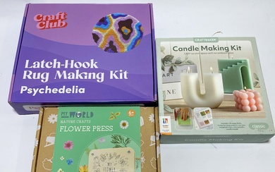 A group of craft kits including rug making kit
