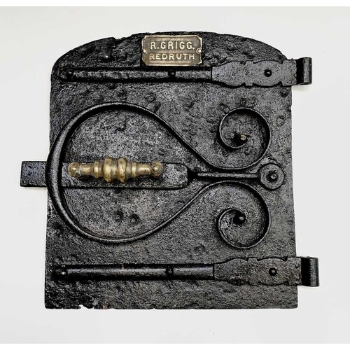 A heavy cast iron Cornish range door, late 19th century, the...