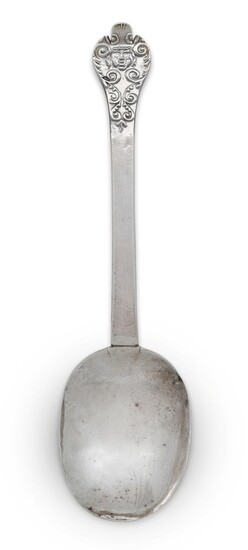 A lace-back silver trefid spoon with decorated front, London, c.1680, Edward Hulse, the reverse of the terminal prick dot engraved TH over IH, 1683, the front designed with a face within scrolling border, foliate scrolls to reverse of bowl, 18.8cm...