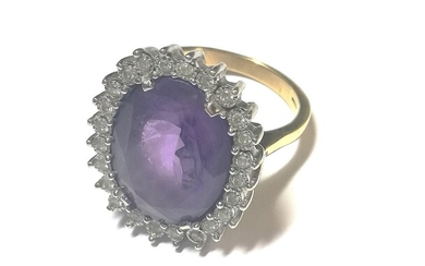 A large amethyst and diamond cluster ring