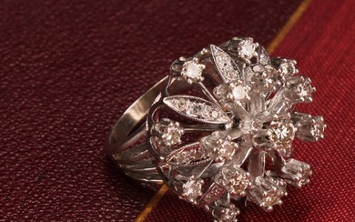 A large and impressive flowerhead diamond cluster ring, the ...