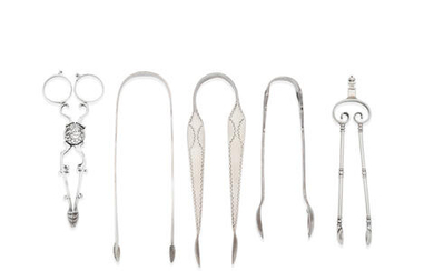 A large collection of silver sugar tongs and nips