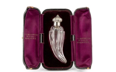 A late Victorian silver mounted glass scent bottle, of curved...