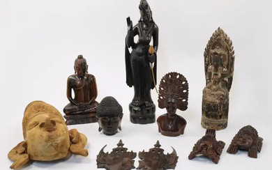 A mixed group of carved wood Asian and South East Asian tourist...