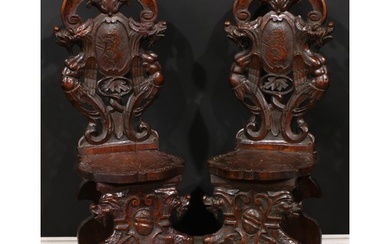 A pair of 19th century Italian walnut sgabelli or hall chair...