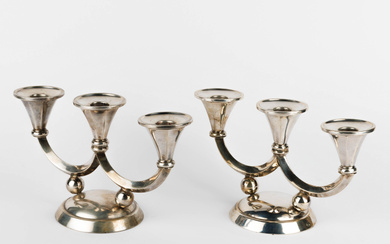 A pair of Art Deco-period silver (835/1000) three-branch candleholders.