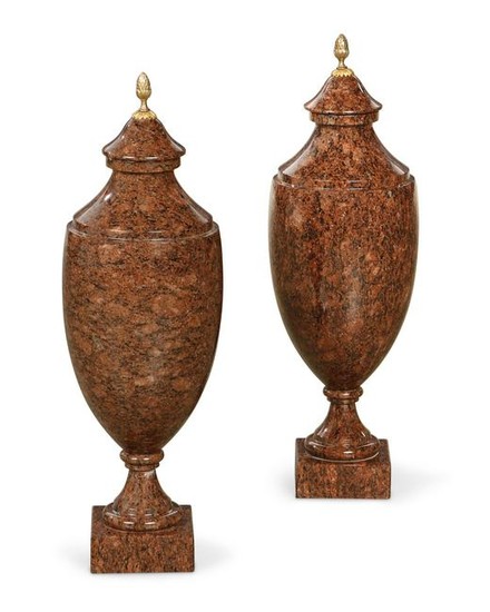 A pair of Baltic Neoclassical style granite urns