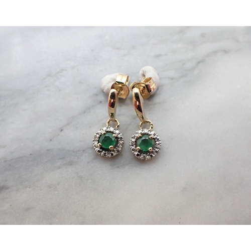 A pair of Emerald and Diamond Earrings each claw-set round e...