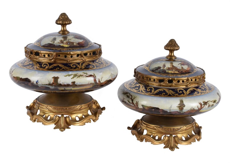 A pair of French porcelain and gilt metal mounted potpourri urns and covers
