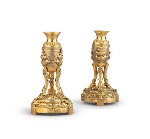 A pair of Louis XVI ormolu tripod candlesticks, late 18th century, probably North European | Paire de flambeaus tripodes Louis XVI en bronze doré, fin du XVIIIème siècle, probalement Nord Européen