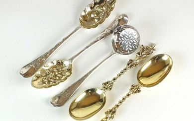 A pair of Victorian silver gilt figural spoons, two silver tablespoons and a sugar sifter spoon