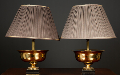 A pair of gilt metal and ebonised table lamps