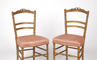 A pair of gilt wood style chairs, marked with label, early 20th century.