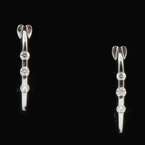 A pair of new 18 carat white gold diamond set hoop earrings