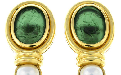 A pair of paste cameo and mabe pearl clip-on earrings, depicting Poseidon and Apollo.