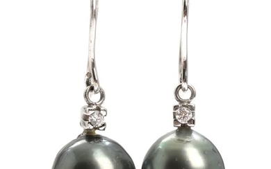 A pair of pearl and diamond earrings set with cultured Tahiti pearls and brilliant-cut diamonds, mounted in 14k white gold. L. 3.2 cm. (2)