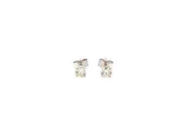 A pair of single stone diamond ear studs