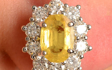 A pair of yellow sapphire and brilliant-cut diamond cluster earrings.