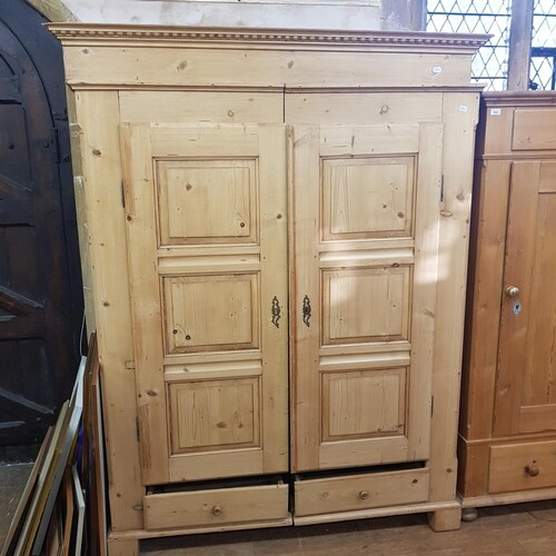 A pine wardrobe, 146 cm wide, and a pine hall cupboard, 95 c...