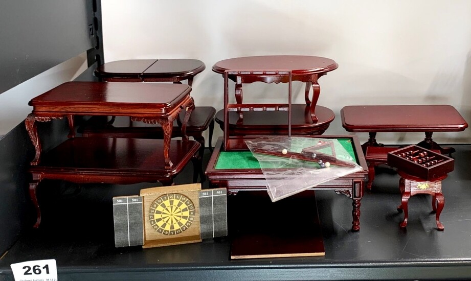 A quantity of dolls house wooden tables, including a snooker table and components and a darts board.