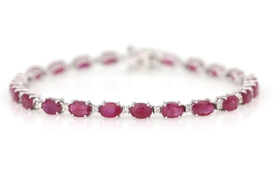 SOLD. A ruby and diamond bracelet set with numerous rubies weighing a total of app. 11.85 ct. and diamonds, mounted in 14k white gold. L app. 18.5 cm. – Bruun Rasmussen Auctioneers of Fine Art