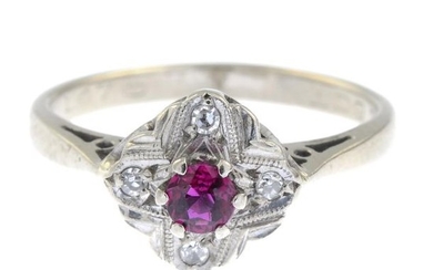 A ruby and diamond ring.Estimated total diamond weight...