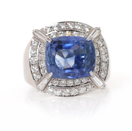 NOT SOLD. A sapphire and diamond ring set with a untreated sapphire weighing app. 7.57 ct. encircled by numerous diamonds, mounted in platinum. Size 51. – Bruun Rasmussen Auctioneers of Fine Art