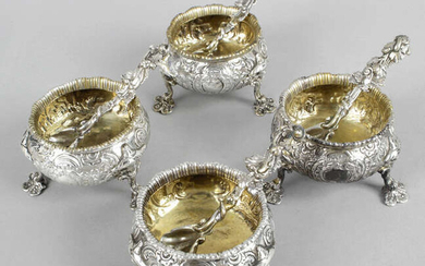 A set of four George IV Irish silver open salts, together with four matched spoons.