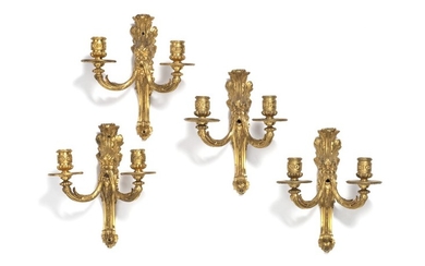 A set of two pairs of French gilt bronze wall lights each with twin candle arms. First half of the 18th century. H. 26 cm. (4)