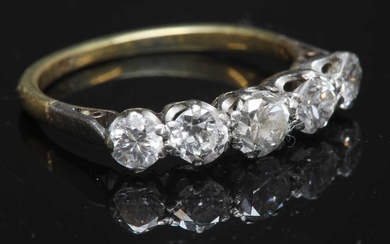 A two colour gold graduated five stone diamond ring