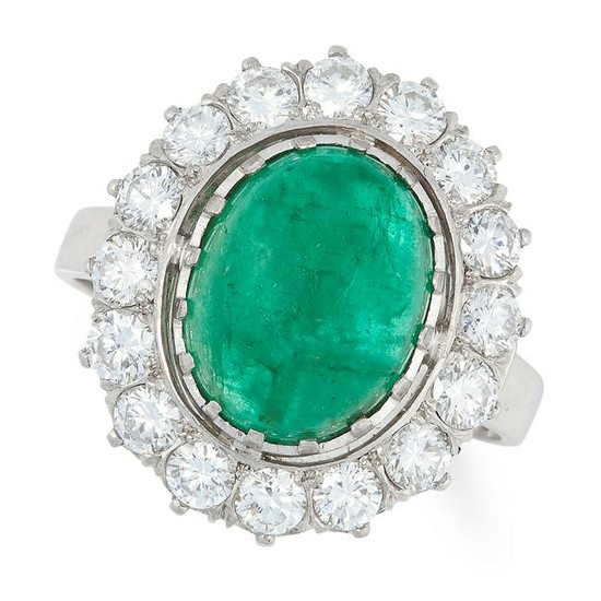 AN EMERALD AND DIAMOND CLUSTER RING set with a cabochon